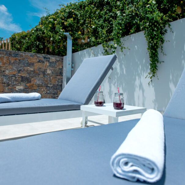 Sunbeds and outside shower from Elounda Sunshine Place