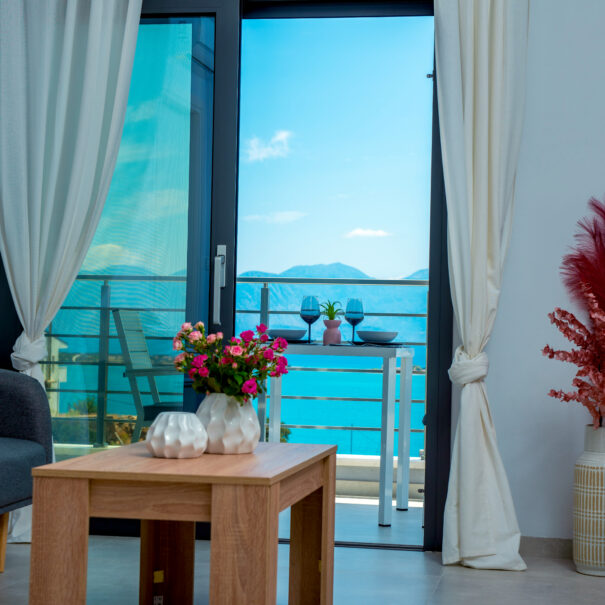 Living room with balcony and sea view from Elounda sunshine Place